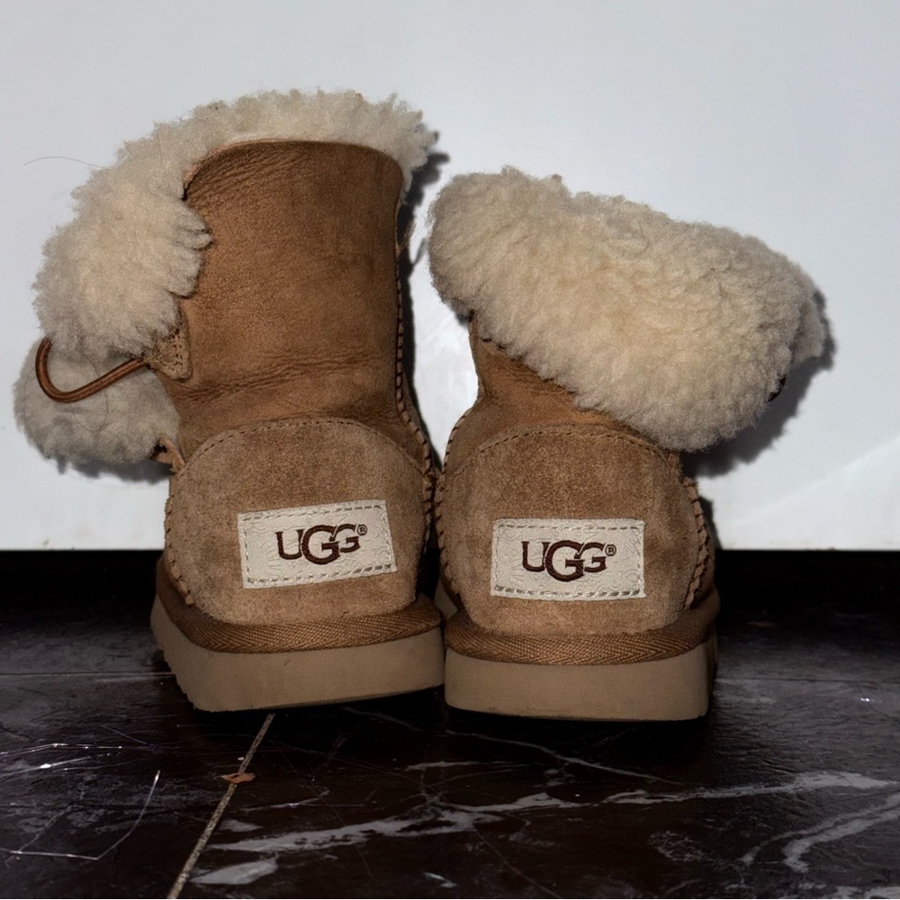 UGG kids Tan Sheepskin Boots size8 used. Rips front of the shoes.